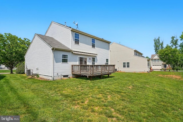 rear view of property featuring a wooden deck, cooling unit, and a yard