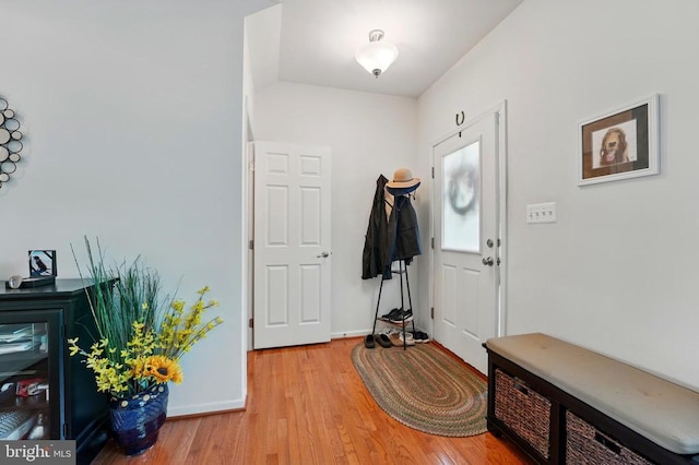 entrance foyer featuring light wood-type flooring and baseboards