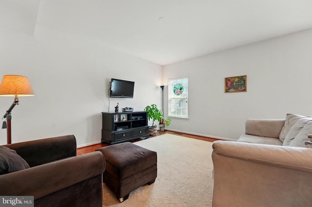 living room with wood finished floors and baseboards