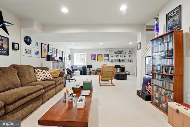 living room with recessed lighting and carpet floors