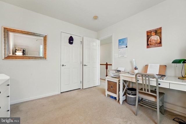 office with light colored carpet and baseboards