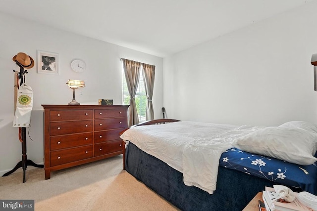 bedroom with light carpet