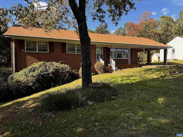 ranch-style house with covered porch, brick siding, and a front lawn