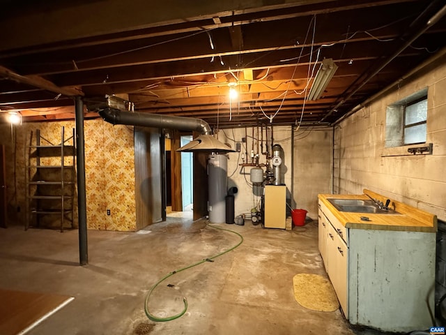 below grade area with a sink, water heater, and a heating unit