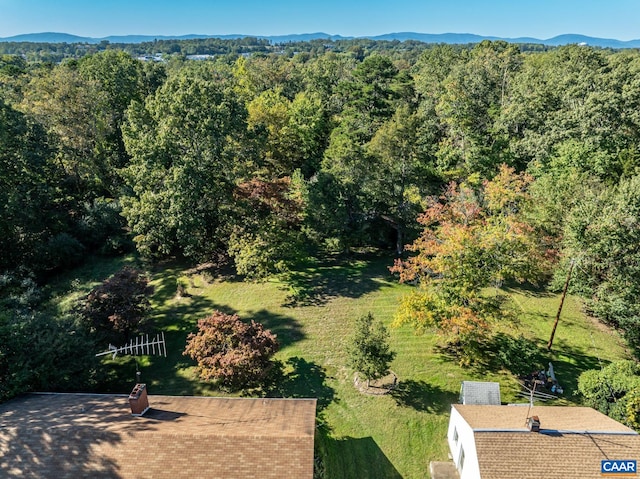 bird's eye view with a mountain view and a wooded view