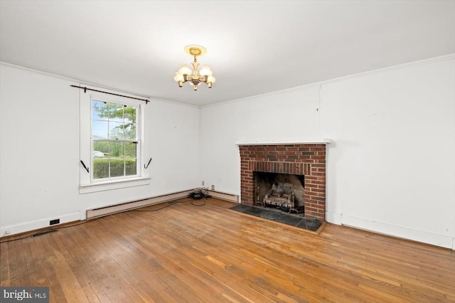 2188 Seville Rd, Madison, VA 22727 - unfurnished living room featuring a chandelier, hardwood / wood-style floors, a baseboard heating unit, crown molding, and a fireplace