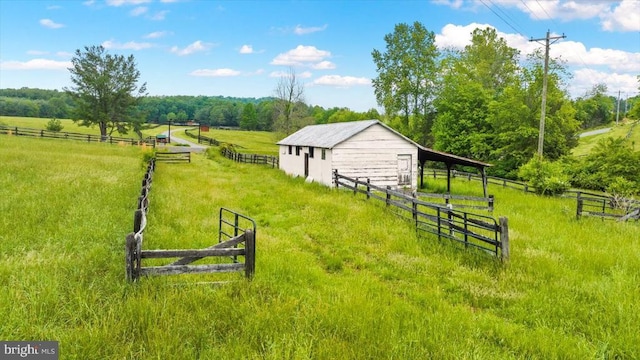 2188 Seville Rd, Madison, VA 22727 - view of yard with an outdoor structure, fence, a view of countryside, and an exterior structure