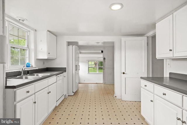 2188 Seville Rd, Madison, VA 22727 - kitchen featuring dark countertops, white appliances, white cabinetry, and a sink