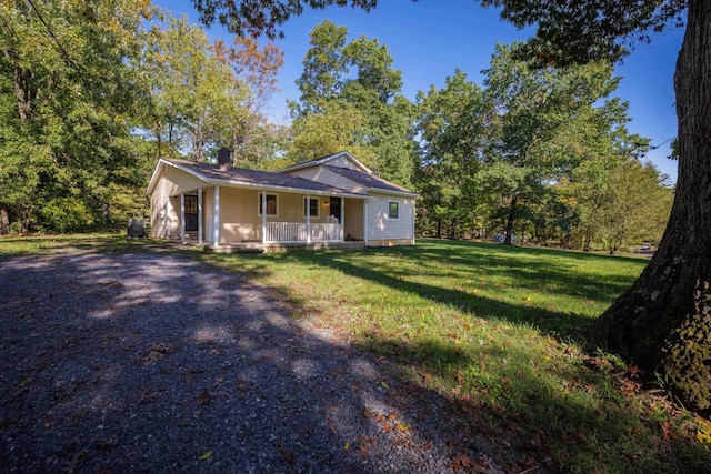 view of front of house with a porch and a front lawn