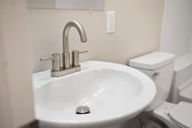 room details featuring toilet and sink