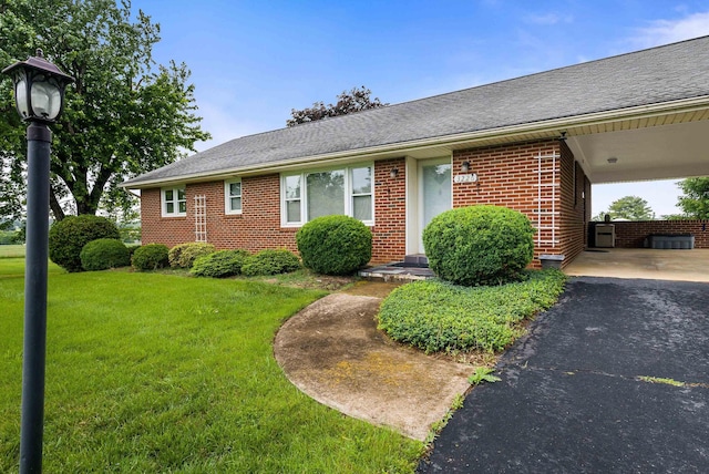 3226 Old Thirty Three Rd, Rockingham, VA 22801 - view of front of home featuring a front lawn, brick siding, roof with shingles, and asphalt driveway