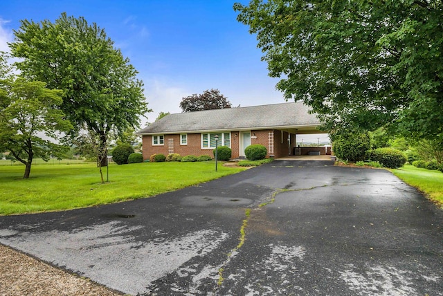 3226 Old Thirty Three Rd, Rockingham, VA 22801 - ranch-style house with a front yard, brick siding, driveway, and an attached carport