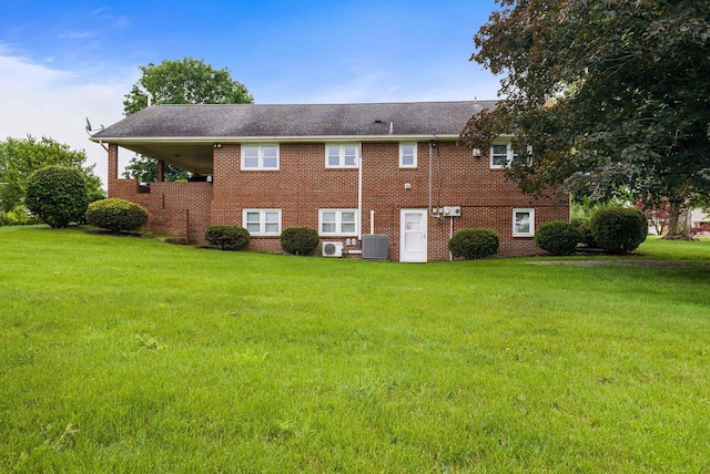 3226 Old Thirty Three Rd, Rockingham, VA 22801 - rear view of property featuring a yard, brick siding, and central AC unit