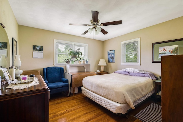 3226 Old Thirty Three Rd, Rockingham, VA 22801 - bedroom with multiple windows, wood finished floors, and a ceiling fan