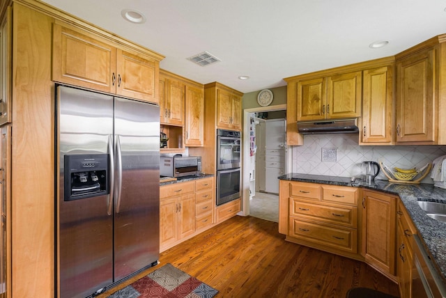 3226 Old Thirty Three Rd, Rockingham, VA 22801 - kitchen featuring appliances with stainless steel finishes, dark wood finished floors, decorative backsplash, recessed lighting, and under cabinet range hood
