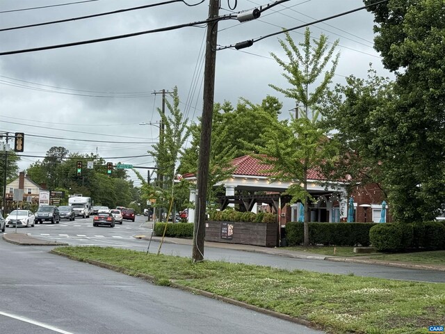 2108 Jefferson Park Ave, Charlottesville, VA 22903 - view of asphalt road with traffic lights, curbs, and street lighting