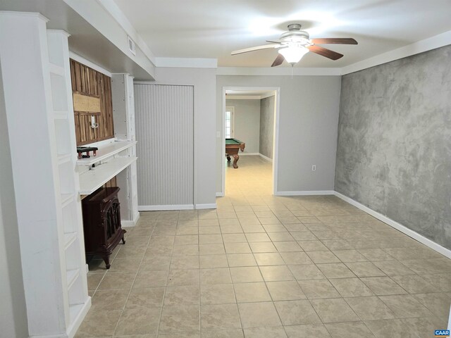 1060 E River Rd, Palmyra, VA 23055 - unfurnished living room with a wood stove, ceiling fan, billiards, and light tile patterned floors