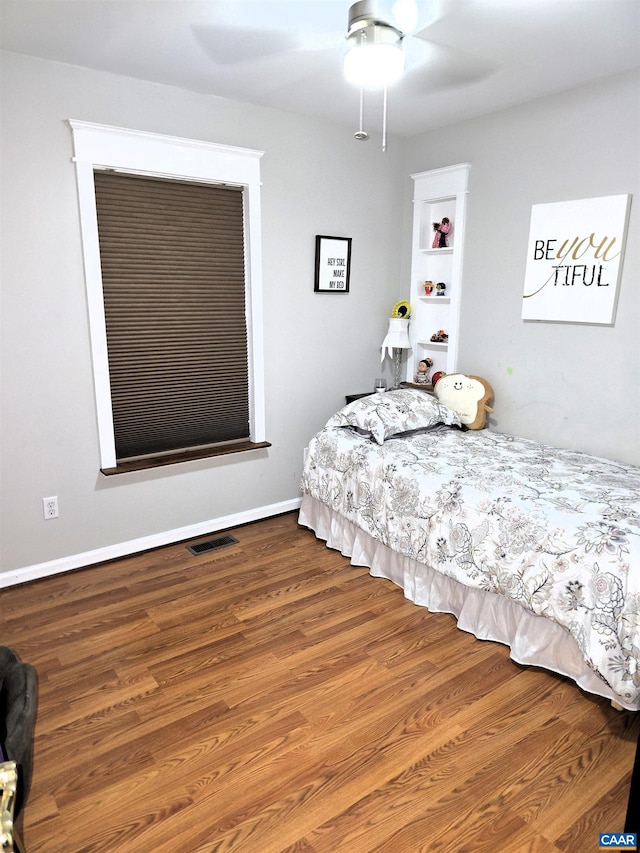 1060 E River Rd, Palmyra, VA 23055 - bedroom featuring wood finished floors, a ceiling fan, and baseboards