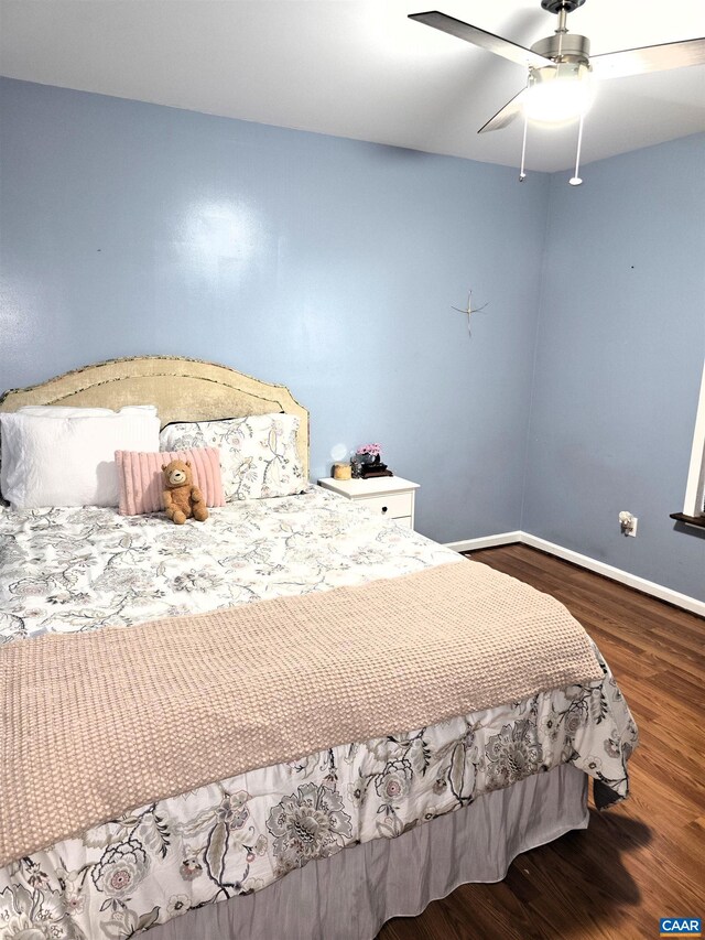 1060 E River Rd, Palmyra, VA 23055 - bedroom with wood finished floors, baseboards, and ceiling fan