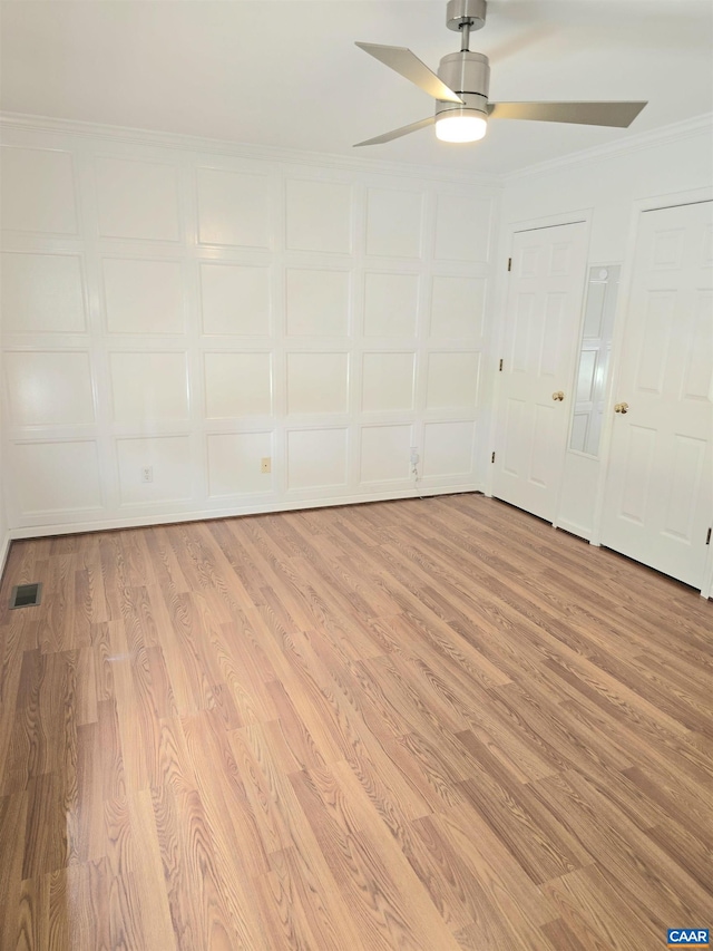 1060 E River Rd, Palmyra, VA 23055 - empty room featuring light wood-style floors, a ceiling fan, and crown molding