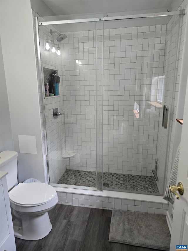 1060 E River Rd, Palmyra, VA 23055 - full bath with toilet, a stall shower, and wood finished floors