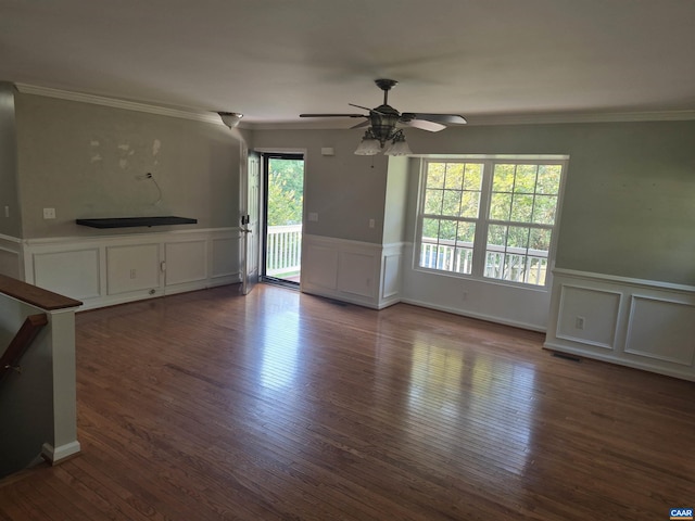 1060 E River Rd, Palmyra, VA 23055 - unfurnished living room with a decorative wall, crown molding, ceiling fan, wood finished floors, and a wainscoted wall