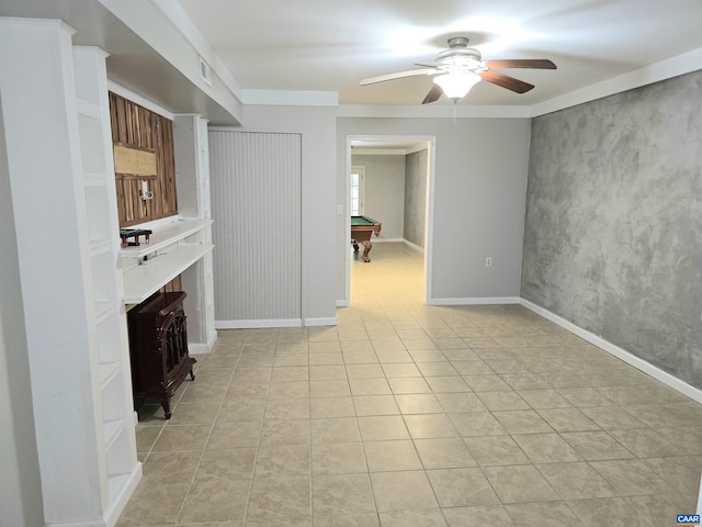 1060 E River Rd, Palmyra, VA 23055 - unfurnished living room with ceiling fan, a wood stove, billiards table, and light tile patterned floors