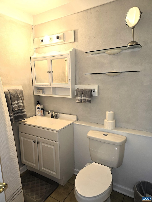 1060 E River Rd, Palmyra, VA 23055 - bathroom with toilet, tile patterned floors, and vanity
