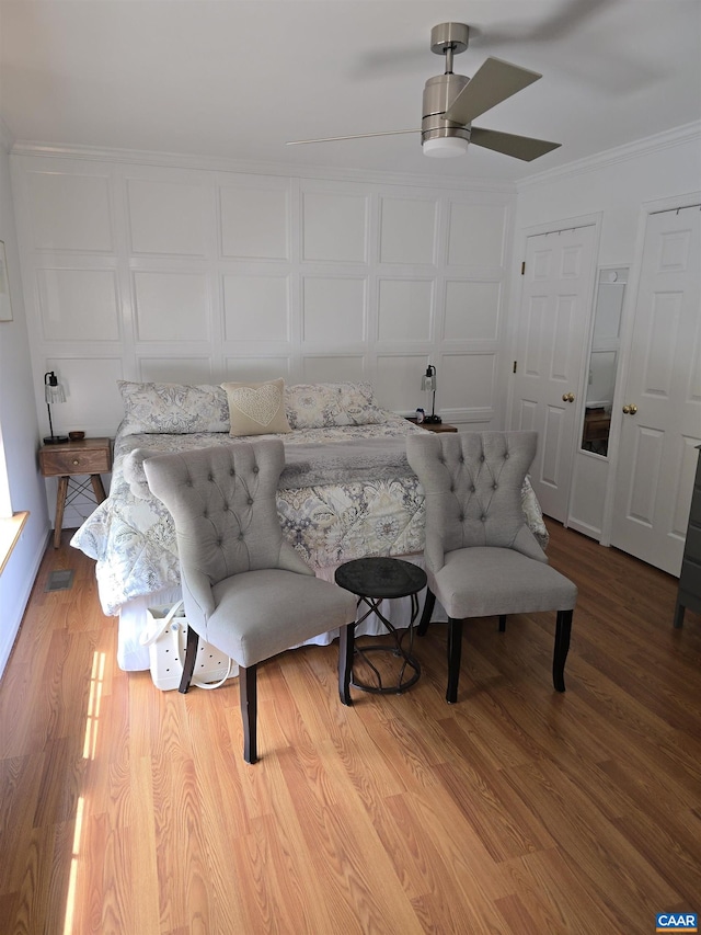 1060 E River Rd, Palmyra, VA 23055 - bedroom with ornamental molding, wood finished floors, and a ceiling fan