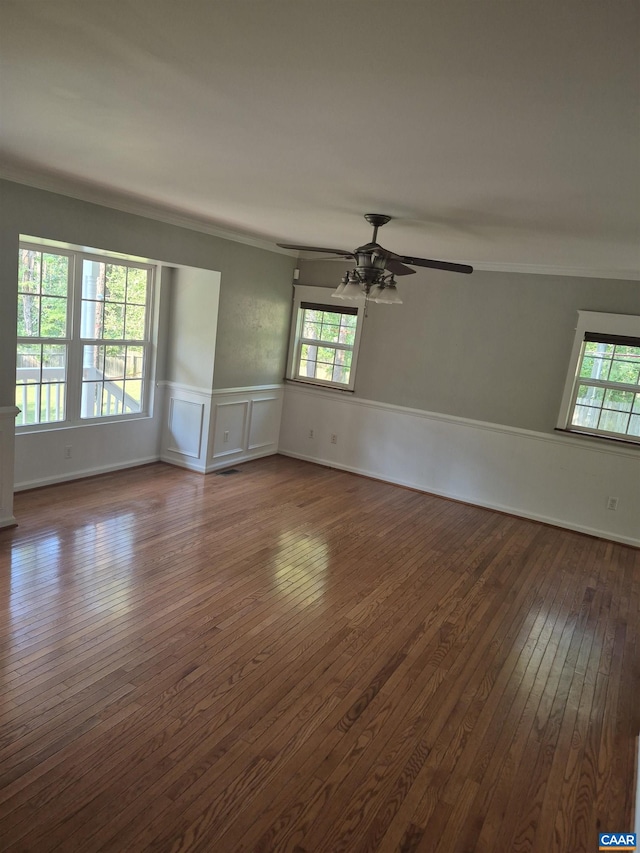 1060 E River Rd, Palmyra, VA 23055 - spare room featuring dark wood-style floors, wainscoting, healthy amount of natural light, ceiling fan, and ornamental molding