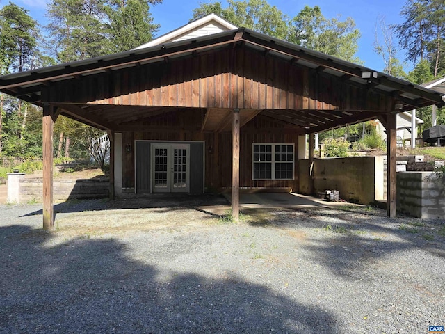 1060 E River Rd, Palmyra, VA 23055 - exterior space with french doors, a carport, and gravel driveway