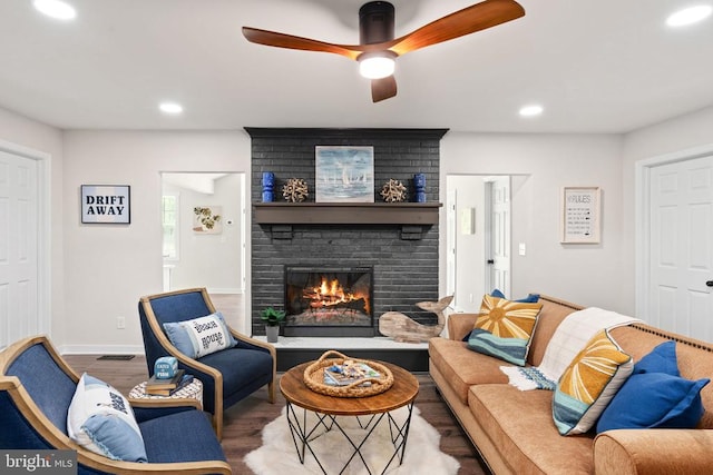 121 Birchside Cir, Locust Grove, VA 22508 - living room with wood finished floors, recessed lighting, ceiling fan, a fireplace, and baseboards