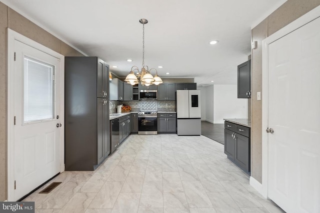 16467 Raccoon Ford Rd, Culpeper, VA 22701 - kitchen featuring stainless steel appliances, a chandelier, backsplash, light countertops, and decorative light fixtures