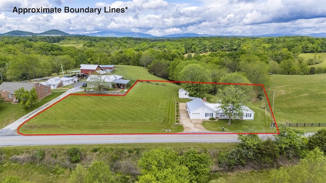 overview of rural landscape featuring property parcel outlined and a heavily wooded area
