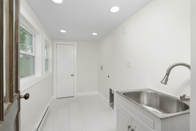 washroom featuring cabinet space, recessed lighting, baseboards, a baseboard heating unit, and light tile patterned flooring