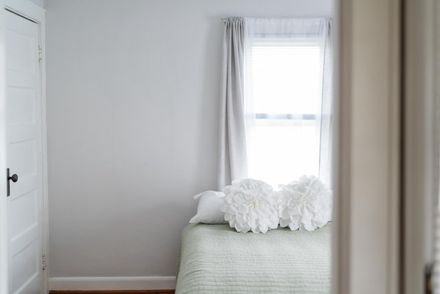 bedroom featuring baseboards