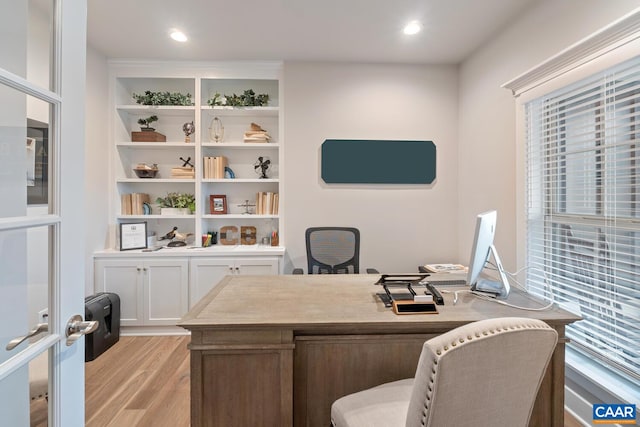 home office featuring light wood-style flooring