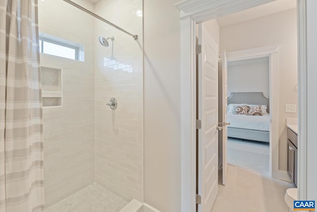 ensuite bathroom with vanity, ensuite bathroom, and a stall shower