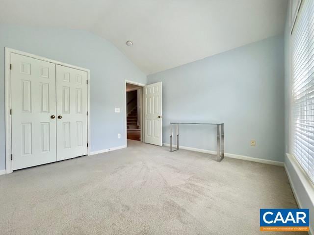 151 Deer Run Dr, Zion Crossroads, VA 22942 - unfurnished bedroom featuring lofted ceiling, carpet, multiple windows, and baseboards
