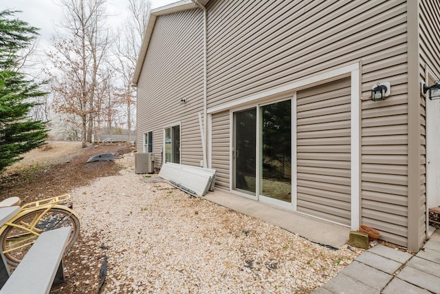 back of property featuring central AC unit