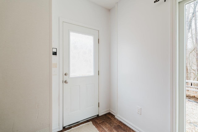 doorway to outside featuring dark wood-style flooring