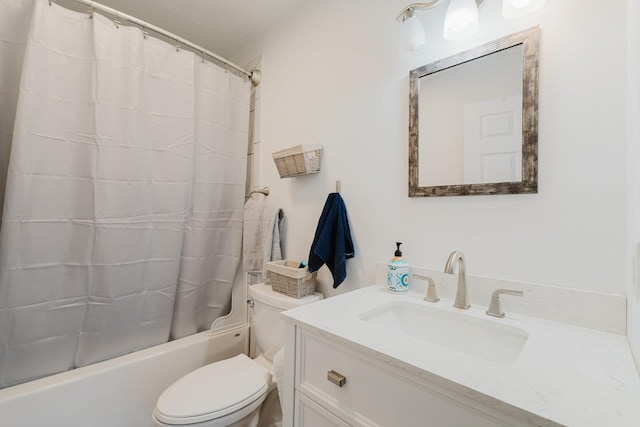 bathroom featuring vanity, toilet, and shower / tub combo