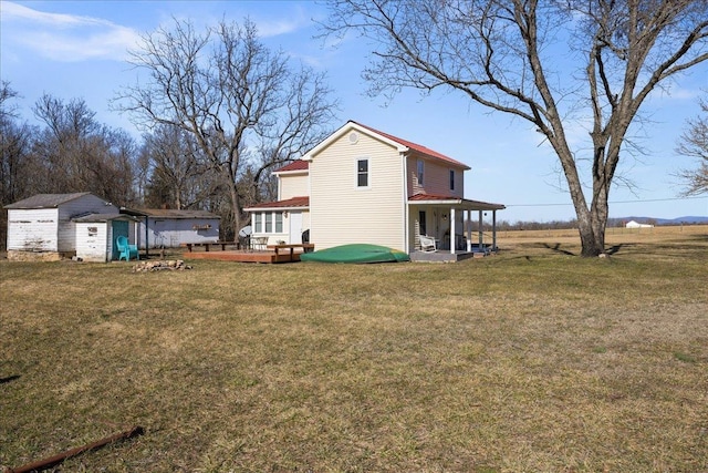 6772 S E Side Hwy, Elkton, VA 22827 - back of property featuring a lawn, an outdoor structure, a patio area, a deck, and a storage shed