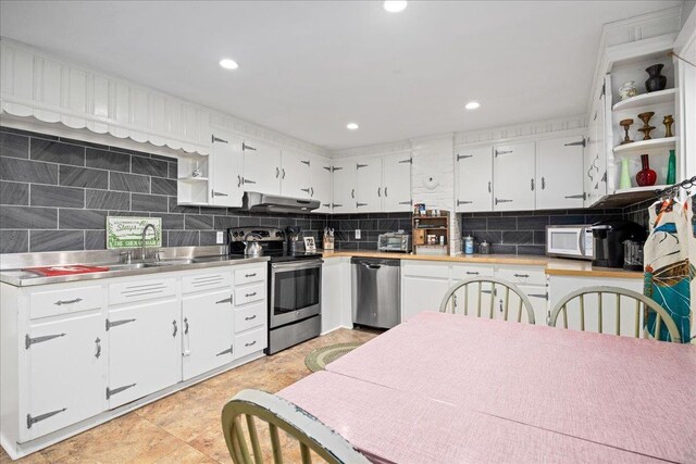 6772 S E Side Hwy, Elkton, VA 22827 - kitchen featuring stainless steel counters, appliances with stainless steel finishes, open shelves, under cabinet range hood, and white cabinetry