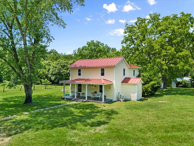 6772 S E Side Hwy, Elkton, VA 22827 - rear view of house with a standing seam roof, metal roof, a lawn, a patio area, and view of scattered trees