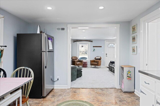 6772 S E Side Hwy, Elkton, VA 22827 - kitchen featuring freestanding refrigerator, white cabinets, recessed lighting, baseboards, and light colored carpet