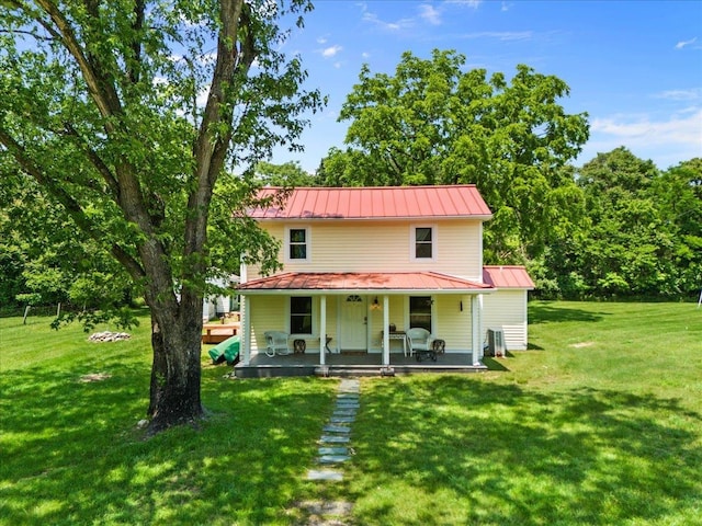 6772 S E Side Hwy, Elkton, VA 22827 - view of front of house with metal roof, covered porch, a front yard, a standing seam roof, and cooling unit