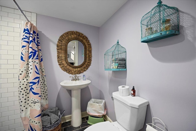 6772 S E Side Hwy, Elkton, VA 22827 - full bathroom with tiled shower, toilet, tile patterned floors, baseboards, and a sink