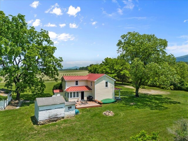 6772 S E Side Hwy, Elkton, VA 22827 - view of grassy yard featuring a deck and an outbuilding