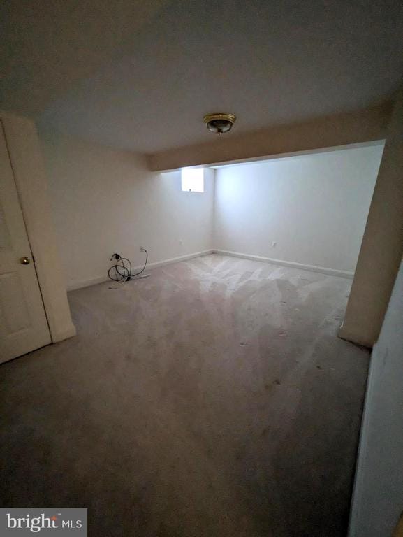 basement with carpet flooring and baseboards